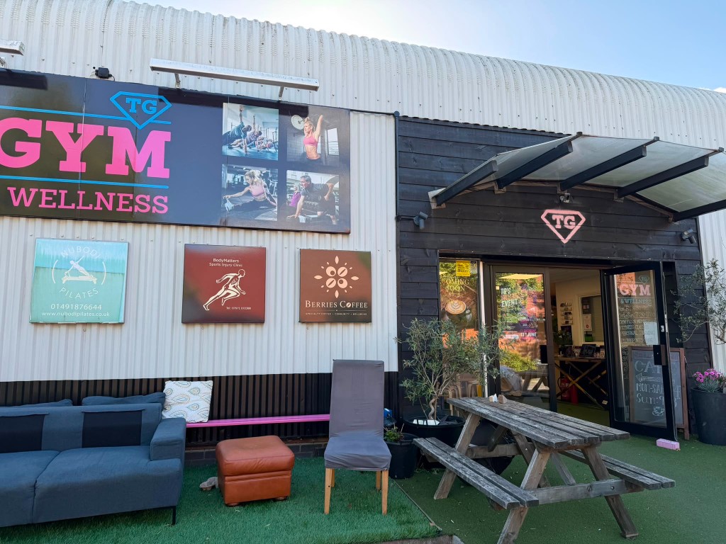TG Gym and Wellness exterior with Berries Coffee signage